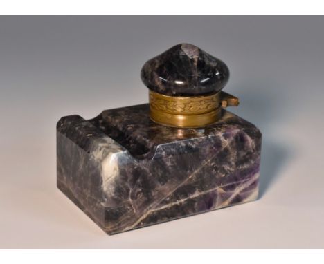 An Amethyst quartz inkwell, hinged cover, dished pen rest, 7cm deep