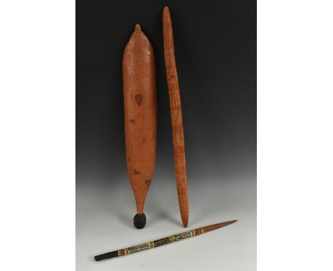 Tribal Art - an Australian Aboriginal woomera spear thrower, painted and decorated in earth pigments, 69.5cm long; a digging 