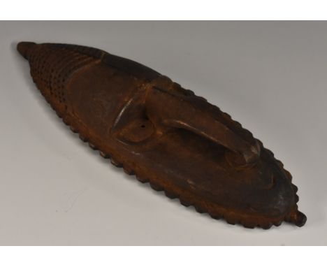Tribal Art - a Papua New Guinea mask, stylized geometric features, 25.5cm long, Sepik River