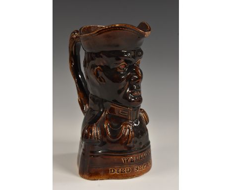 Napoleonic Wars - a 19th century treacle-glazed commemorative 'Toby' jug, modelled as a portrait of the Duke of Wellington, i