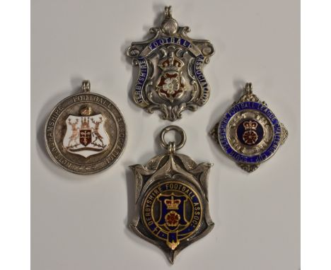 Local Interest, Sport, Derbyshire Football Association &amp; League - four silver and enamel shaped presentation fobs, dated 