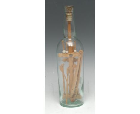 A late 19th century Prisoner-of-War novelty glass bottle diorama, enclosing the Instruments of the Passion in softwood, the s