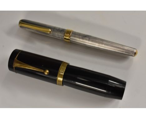 Pens - an oversize fountain pen, brass fittings, 13cm long; a Diplomat Classic fountain pen, engine turned overall, 14.5cm lo