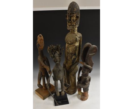 Tribal Art - an Igbo Ikenga figure, the horned warrior alusi stands, a knife in his right hand, a severed head in his left, 6
