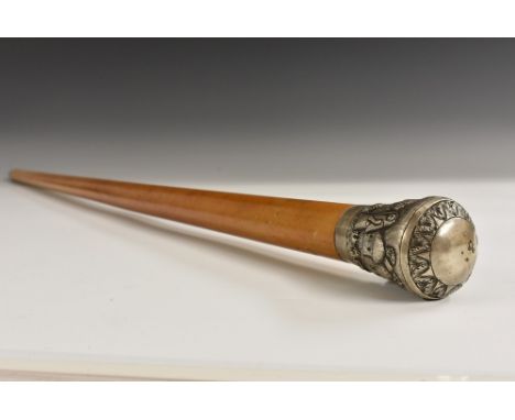 A 19th century Indian silver mounted malacca walking cane, the domed pommel chased with figures in a village, 91cm long, c.18