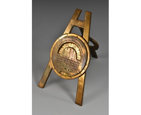 A Negretti &amp; Zambra perpetual easel desk calendar, 8cm register inscribed "Come what may, Time and the Hour run through t