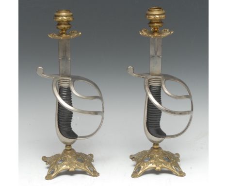 Militaria - a pair of 19th century gilt-brass and sword candlesticks, each fashioned from an army sword's blade, basket, grip