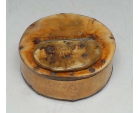 A 19th century folk art cattle horn circular snuff box, hinged cover, traces of sgraffito 'scrimshaw' decoration, 7cm diam