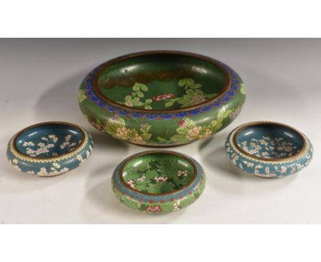 A Chinese cloisonne enamel bowl, decorated with flowers and scrolls on a green ground, 31cm diam, four character mark; others