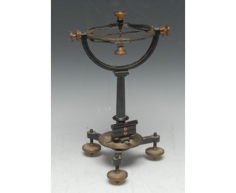 An early 20th century brass and black painted surveyor's instrument, with compass, protractor and level, tripod base with fur