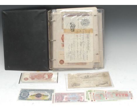 Banknotes, UK, including Provincial: a Boots ring bound collectors' album containing British treasury notes, including Britis