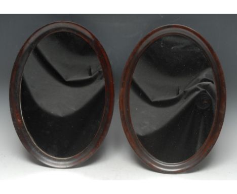 A pair of early 20th century mahogany oval easel table mirrors, quite plain, 38cm x 27.5cm