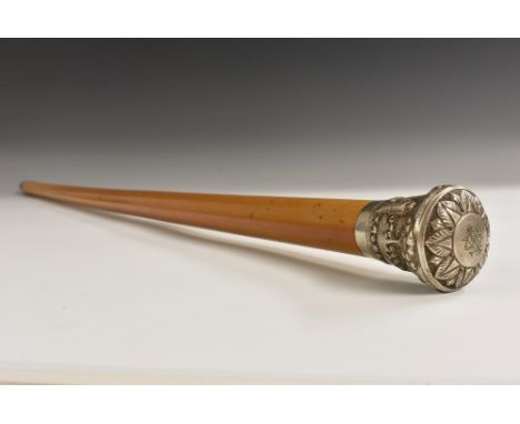 A 19th century Indian silver mounted malacca walking cane, the domed pommel chased with a band of lotus above a deep band of 