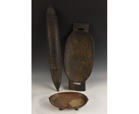 Tribal Art - a Zulu izingqoko food bowl or meat platter, broad lug handles, four feet, 62cm wide, South Africa; others (3)