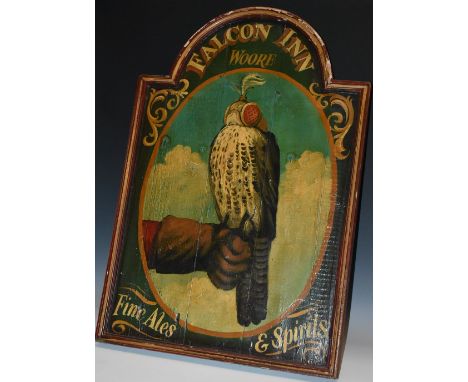 Folk Art - a painted softwood arched rectangular hanging tavern sign, Falcon Inn, Woore, painted with a bird of prey, hooded 