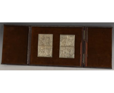 A pair of Italian silver coloured metal presentation plaques, in relief with eight panels telling the life of Christ, each 10