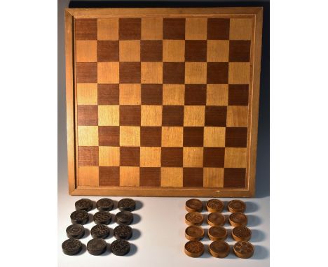 A 19th century boxwood and ebony treen draughts set, each piece engine turned with a sample design, 3cm diam; a mahogany boar