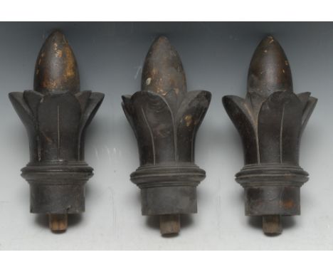 A set of three 19th century oak and parcel gilt architectural finials, each carved as a lotus bud, 20.5cm long, c. 1835, [3] 