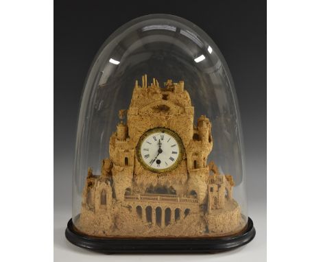 A 19th century novelty cork mantel clock, as a fanciful mountainous landscape with Romanticised ruins, 8cm circular enamel di