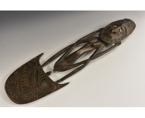 Tribal Art - a Papua New Guinea figural food hook, the 'crocodile man' with stylised oval features, cowrie shell eyes, 51cm l