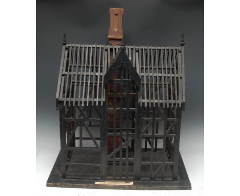 A softwood museum architectural model, of a Tudor Craftsman's House, labelled, 68cm high, carrying case en suite, 20th centur