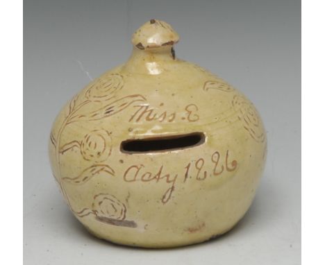 A 19th century Art Pottery onion-shaped stoneware money box, in the Folk Art tradition, glazed throughout in merging sallow t