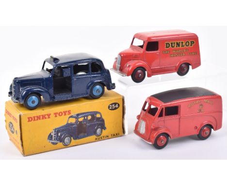 Dinky Toys boxed 254 Austin Taxi and two delivery vans, dark blue Austin taxi with light blue hubs, in yellow picture box wit