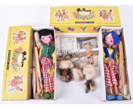 Two boxed Pelham Puppets SS Dutch boy and Dutch girl, both in yellow boxes with instructions together with a loose Pelham Pup