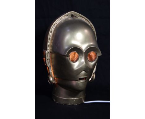 STAR WARS; a model C-3PO head now used as a lamp, offered with a small associated spotlight, height approx 34cm.Additional In
