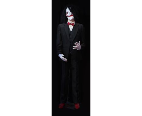 SAW; two Billy masks, the first mounted on a mannequin in suit, height approx 185cm, the second on associated body posed on t