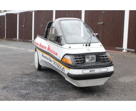 THE BEEGEES; a Mini El City electric car owned by Maurice Gibb as formerly displayed in the London Motor Museum and three ins