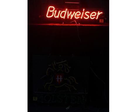 A neon ‘Holsten’ bar sign, width approx 53cm (af), a Budweiser example, and an electronic Gordon's Gin display (3).Additional
