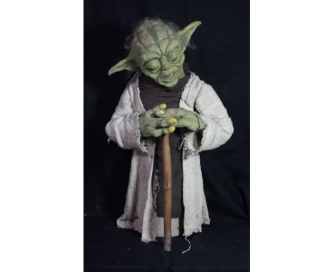 STAR WARS; a foam bust/puppet of Yoda on associated base with stick, height including base approx 79cm.