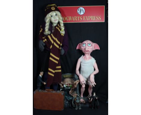 HARRY POTTER; a large foam Dobby the House Elf figure, height including base 80cm, a mannequin dressed as Hermione Granger, a