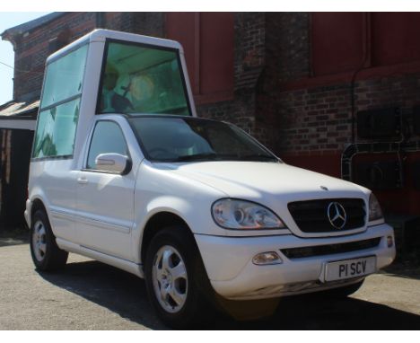 A 'Popemobile' advertising vehicle converted by PaddyPower from a Mercedes ML 320 petrol estate car with perspex rear section