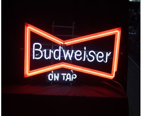 A neon bow-tie ‘Budweiser on Tap’ bar sign, width 68cm.&nbsp;