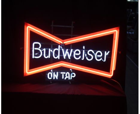 A neon bow-tie ‘Budweiser on Tap’ bar sign, width 68cm.&nbsp;