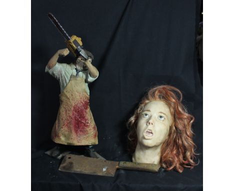 THE TEXAS CHAINSAW MASSACRE; a figure with voice box, height 61.5cm, a silicone bust of a beheaded woman and a rusty cleaver 