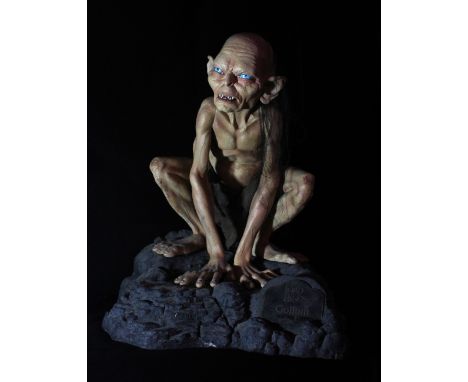 THE LORD OF THE RINGS; a figure of Gollum on modelled rocky base, height 66cm.&nbsp;