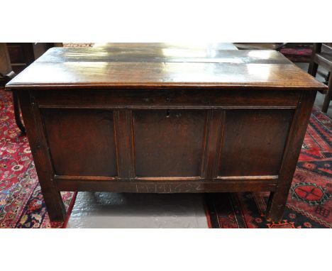 Late 17th century oak coffer, the moulded top above three fielded panels of square form, standing on style feet and having ir