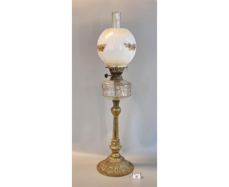 Early 20th Century brass double burner oil lamp with clear glass reservoir on a brass foliate decorated pedestal base, transf
