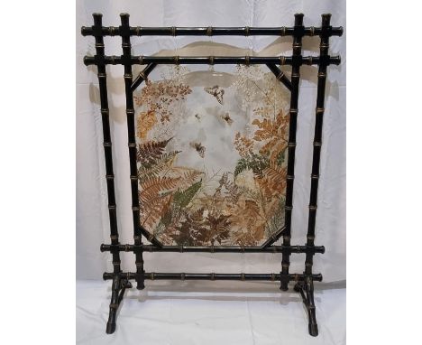 Late 19th Century Aesthetic Movement glass firescreen the frame ebonised and gilded in bamboo style, the glass panel decorate