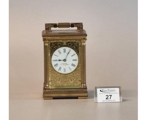 French gilt brass carriage clock with gilded face around white Roman dial marked J.W Benson, London. 12.5cm high approx. (B.P