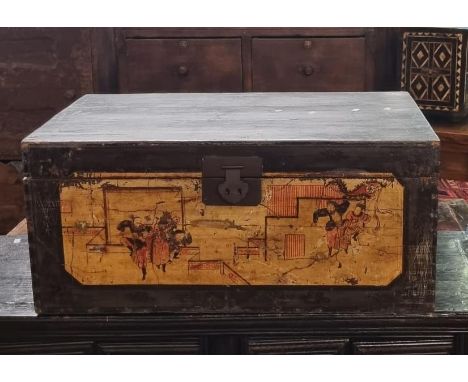 An oriental stained wooden trunk, the front panel painted with immortals amongst buildings, having metal carrying handles and