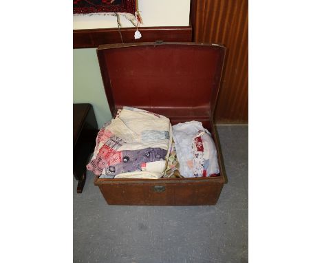 Tin trunk containing quilts and soft goods