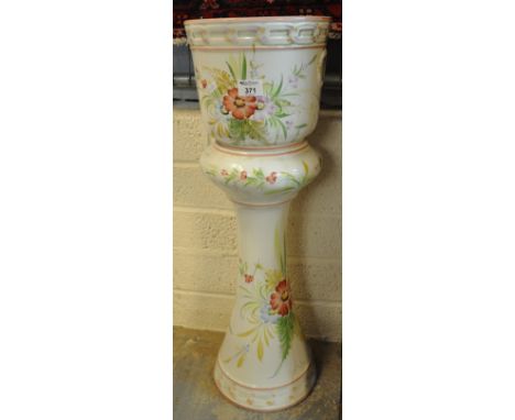 A china plant stand made in Portugal, together with a jug and basin set. (B.P. 21% + VAT) Jug has a crack through base, crazi