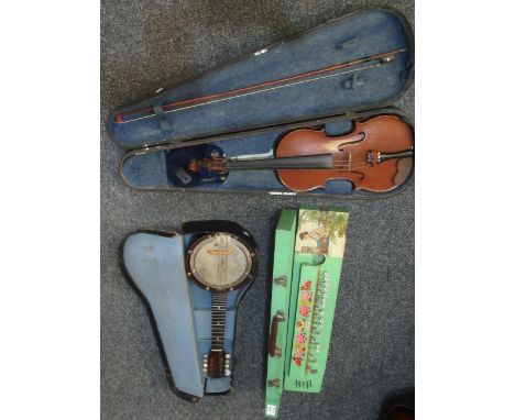 Two cased student violins with bows, one marked Medio Fino, the other Lark. Together with a vintage cased banjo, a Stagg toy 