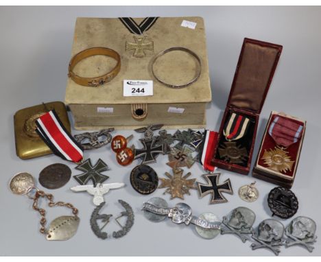 German fabric covered jewellery box containing a large assortment of First and Second World War medals, insignia and other si