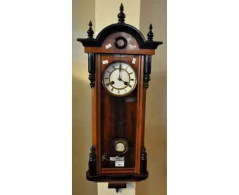 Early 20th Century walnut and ebonised Vienna type two train wall clock with key and pendulum.(B.P. 21% + VAT) 
