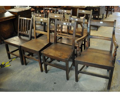 A collection of 19th Century Welsh oak bar and stick back country farmhouse dining chairs, all with solid seats, to include o